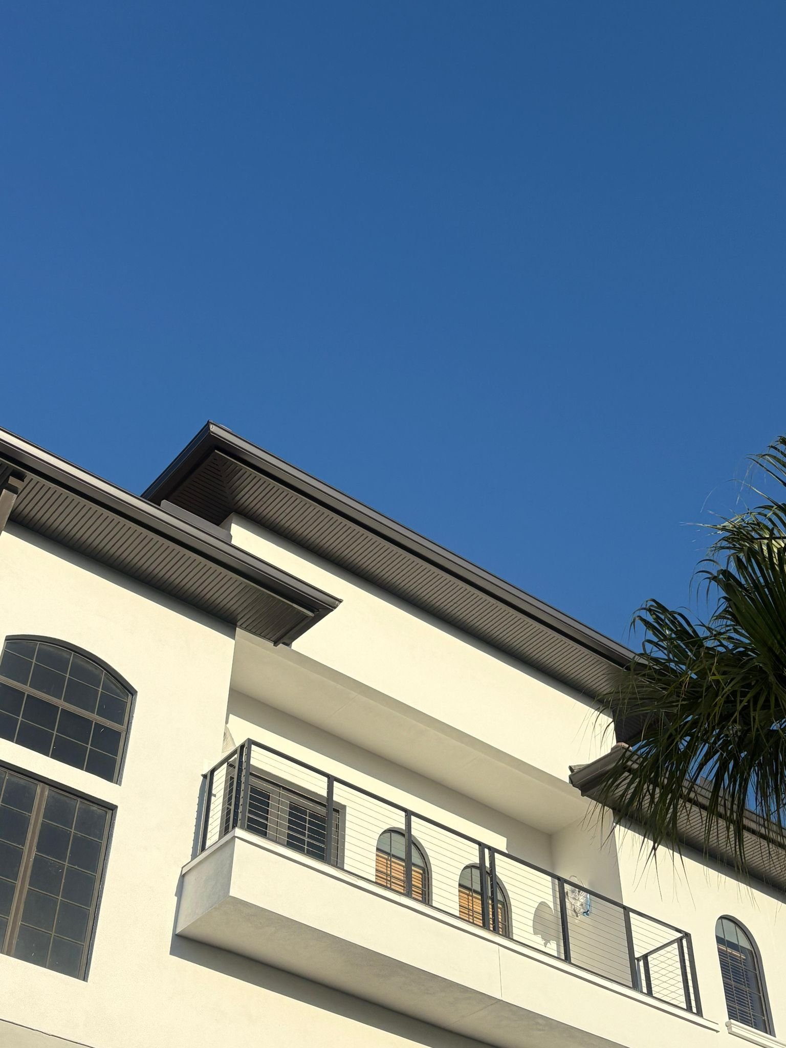 Professional black gutter and fascia installation on a commercial building in Southeast Florida